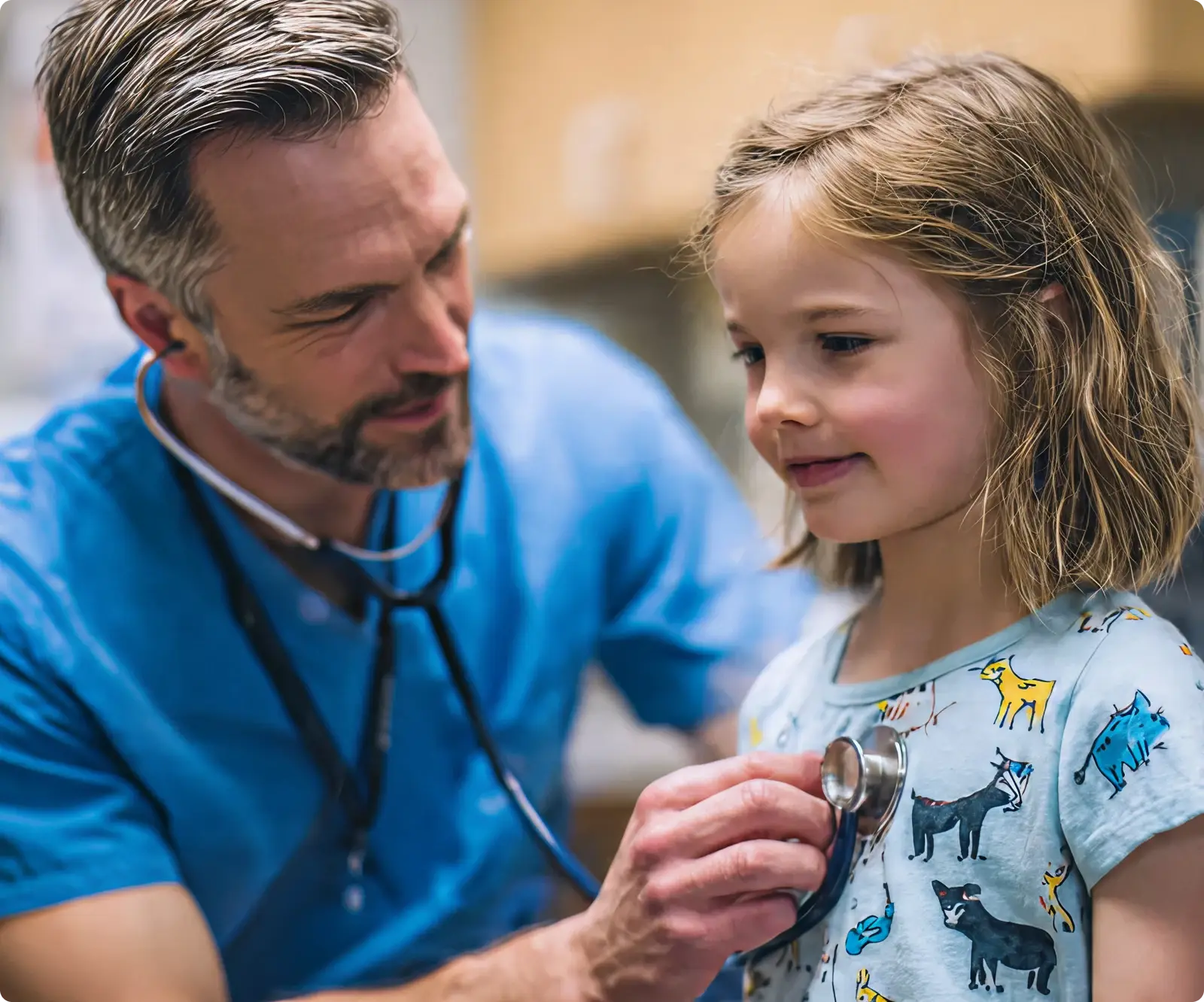 A little girl is being examined by a doctor.
